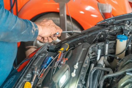 Mechanic working on a car engine